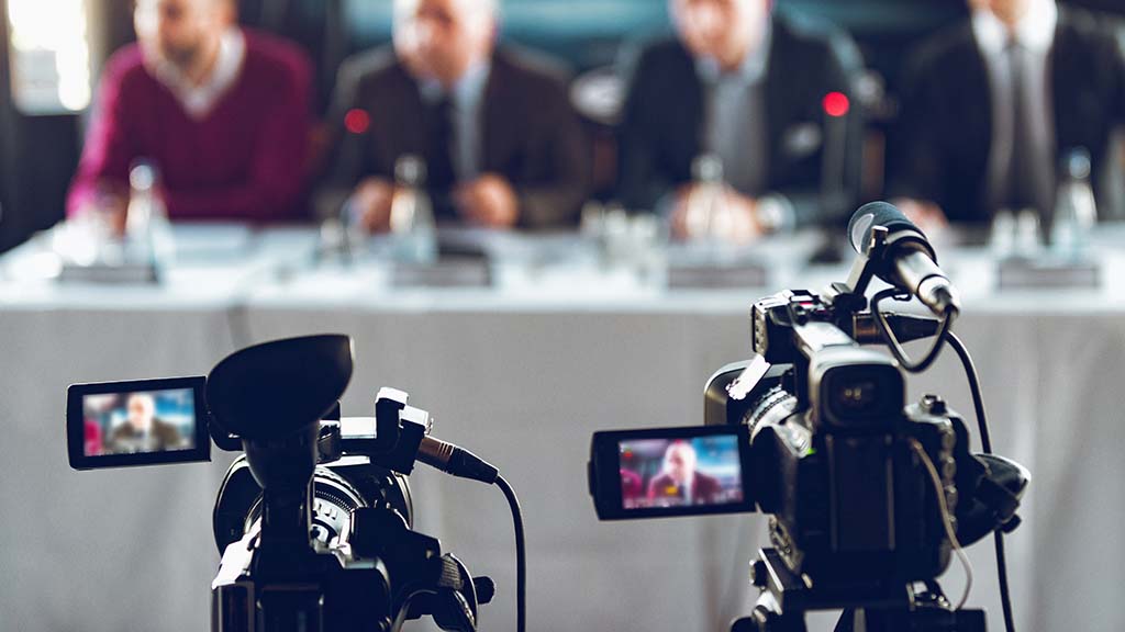 Image of a business live streaming conference.